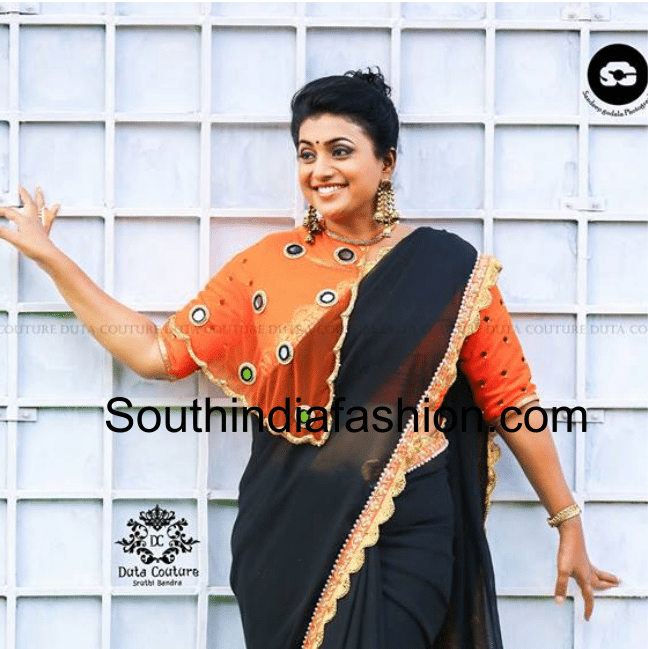 Roja in black saree orange cape blouse