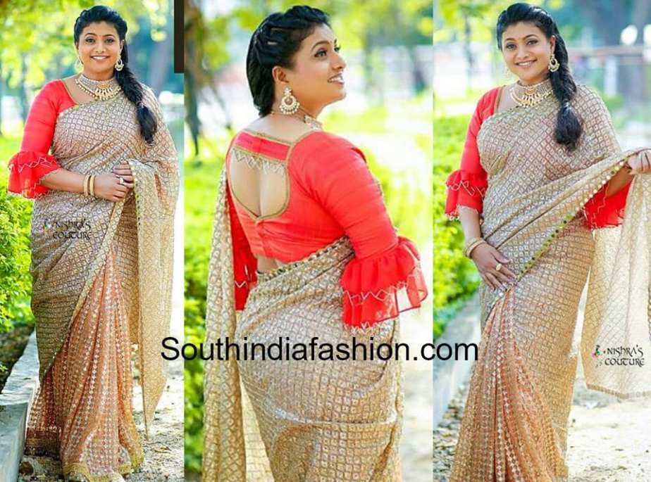 roja in gold saree and ruffle sleeves blouse