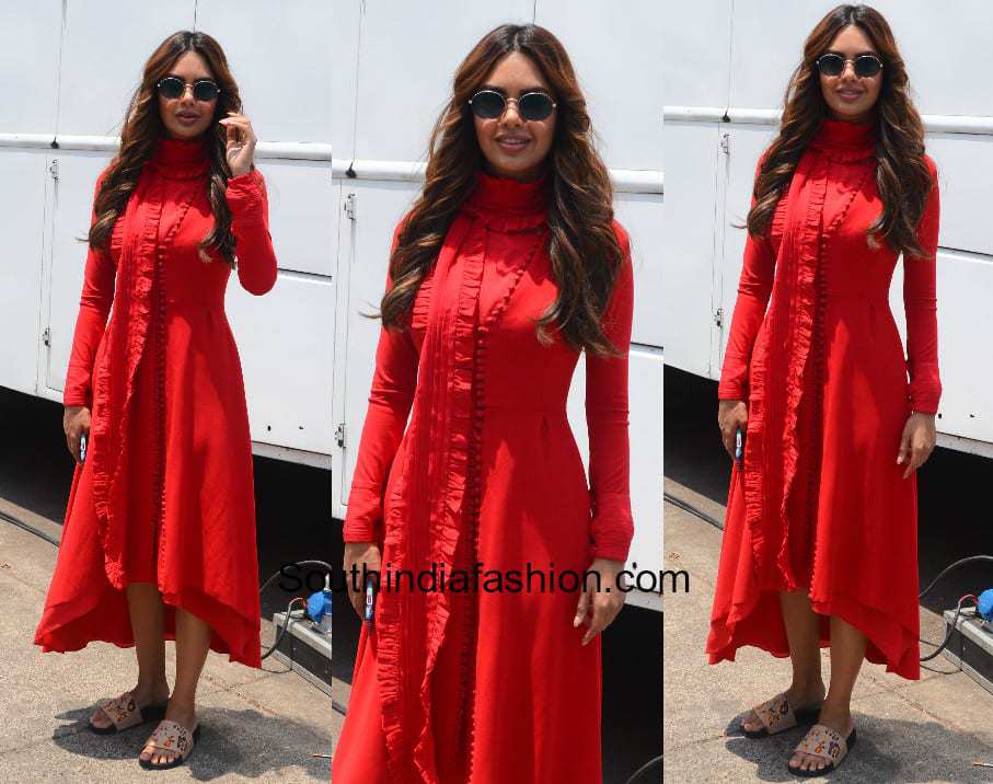 Esha Gupta in a red dress on the sets of a shoot