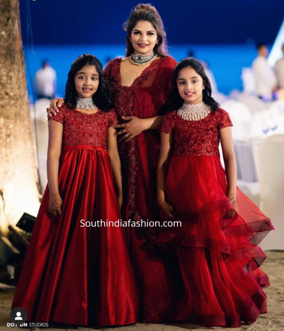 viranica manchu and her daughters in red outfits at sangeet