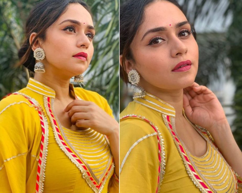 Amruta Khanvilkar in a yellow suit