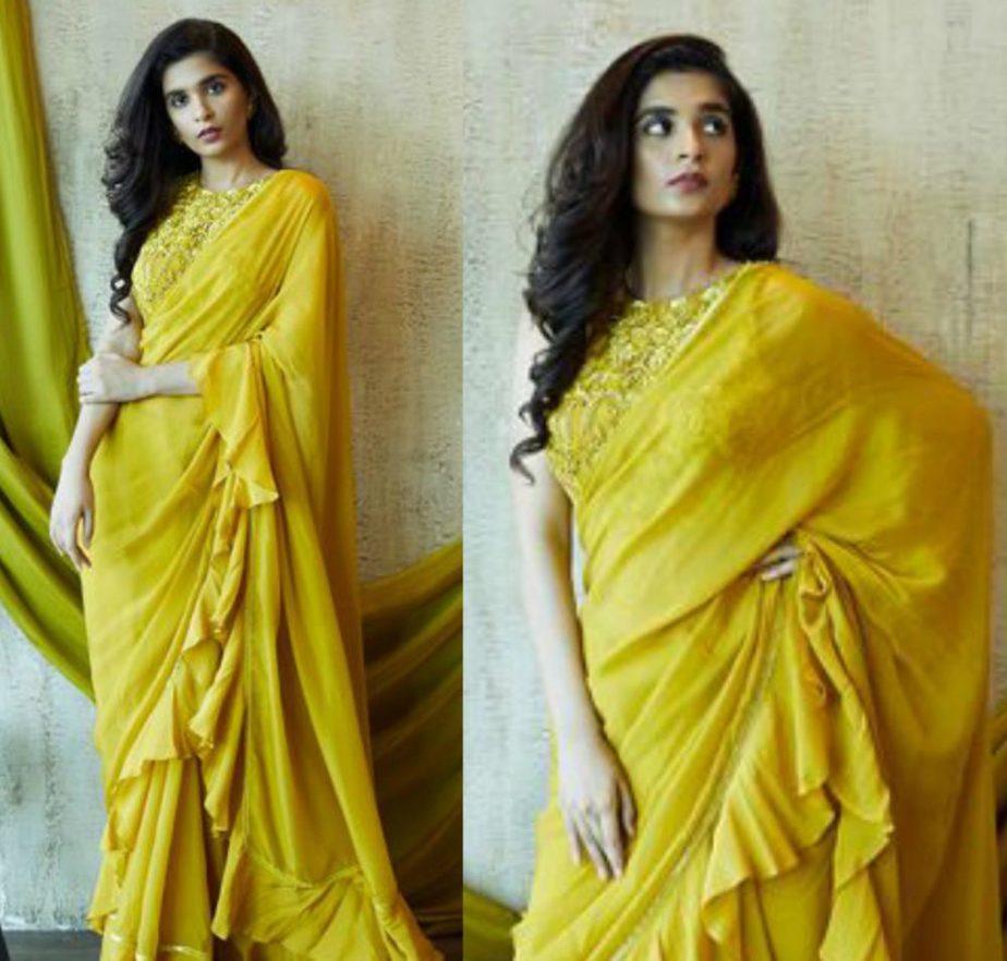 nayantaara mustard yellow saree with ruffles and embroidered blouse