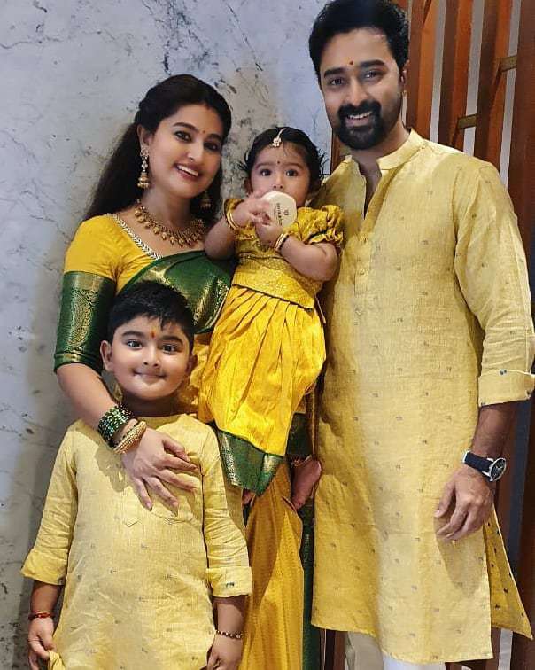 Sneha prasanna in yellow saree by muhurth and prasanna in gold kurta for diwali 2