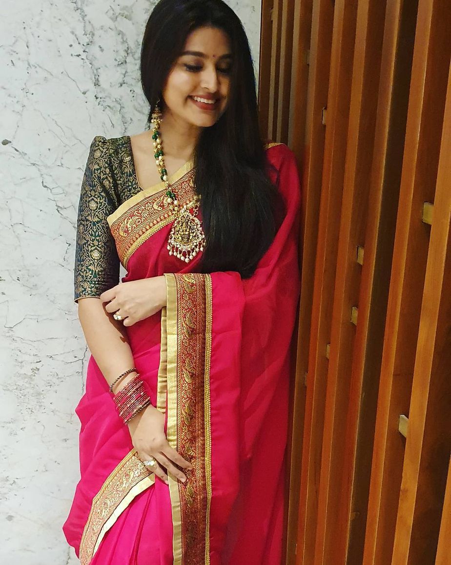 Actress Sneha in a red saree and balck blouse by geethu haut couture1