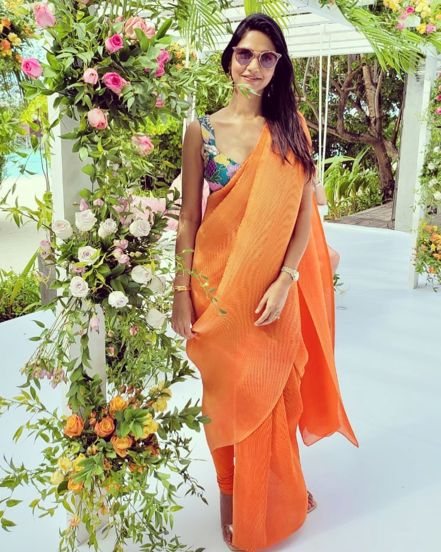 Sneha reddy in an orange pant saree by aisha Rao for a wedding in Maldives