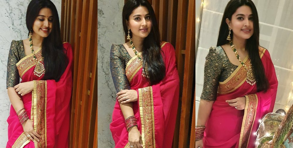 Actress Sneha in a red saree and green blouse by geethu haut couture