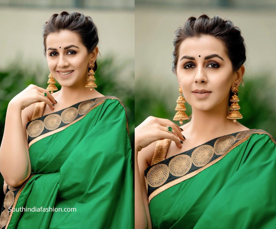 Nikki Galrani in a green and gold traditional saree