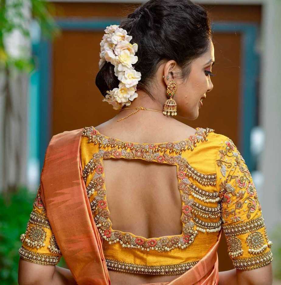 yellow bridal blouse with pearl work by sruthi kannath