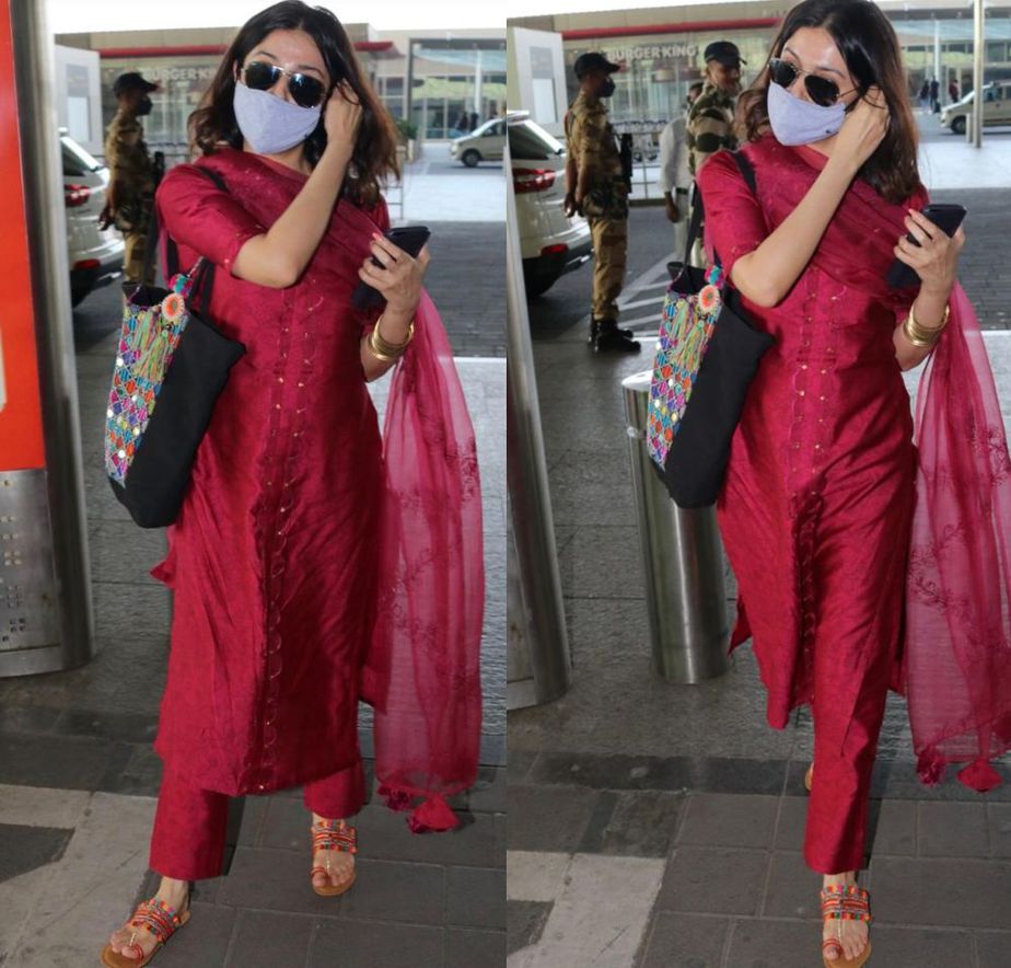divya khosla kumar in red suit at the airport