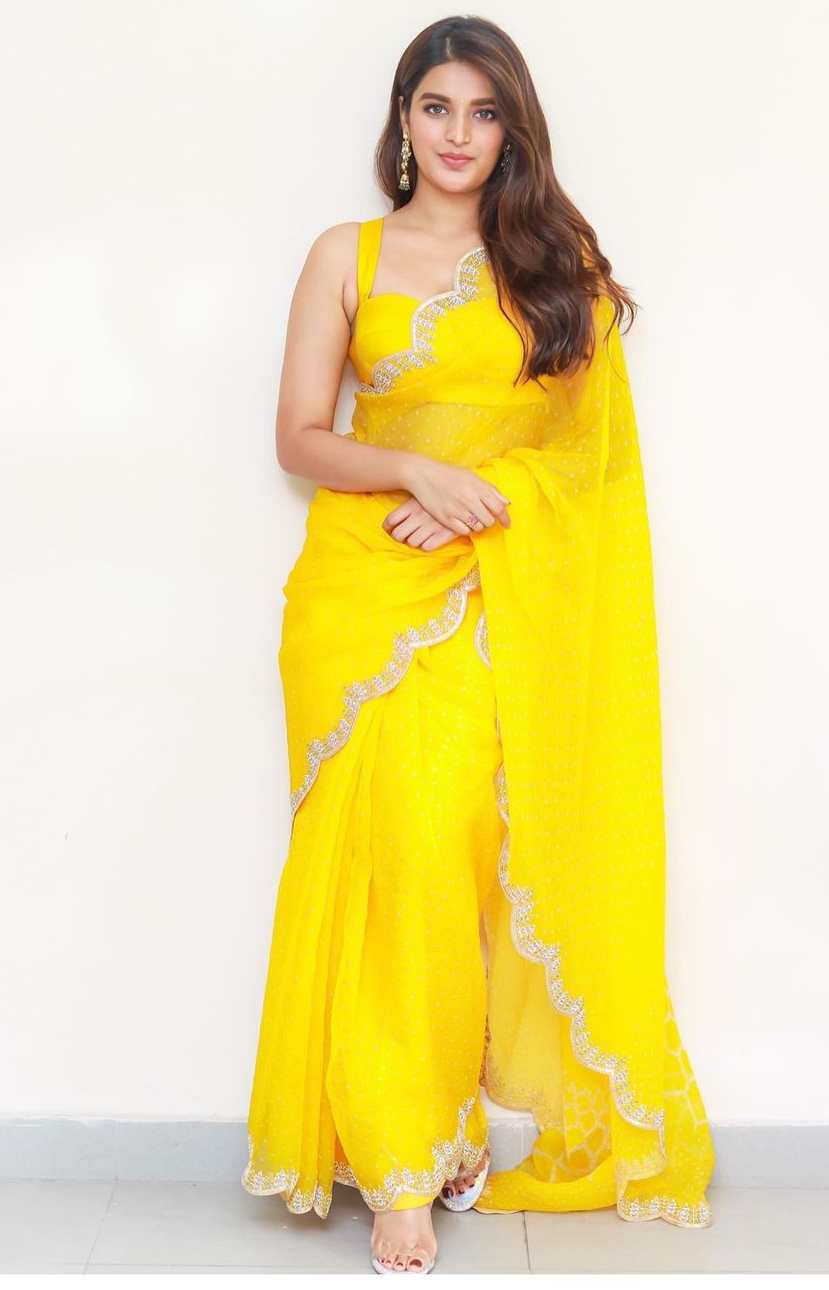 nidhi agerwal in a sunshine yellow saree