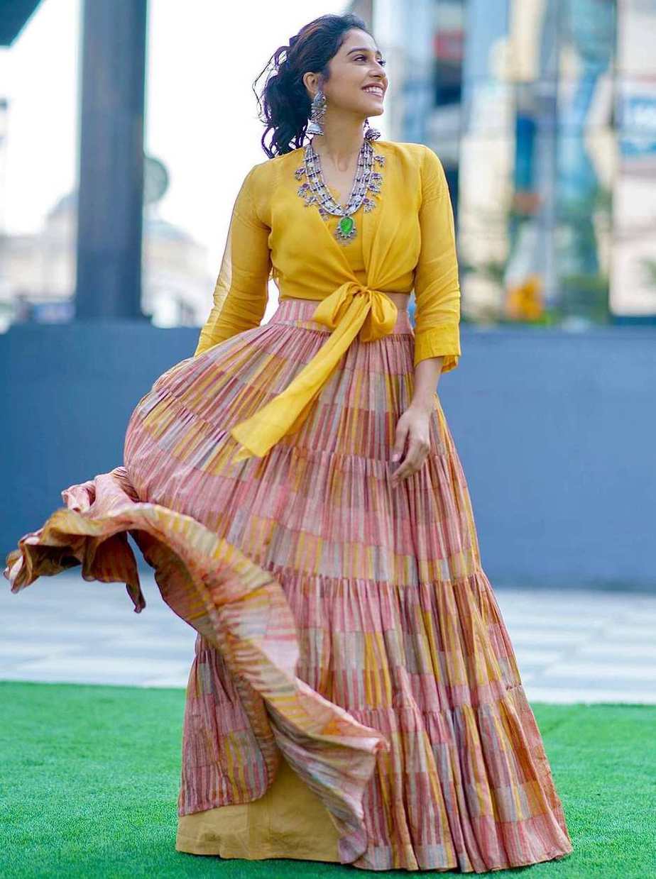 yellow flowing skirt with knotted shirt