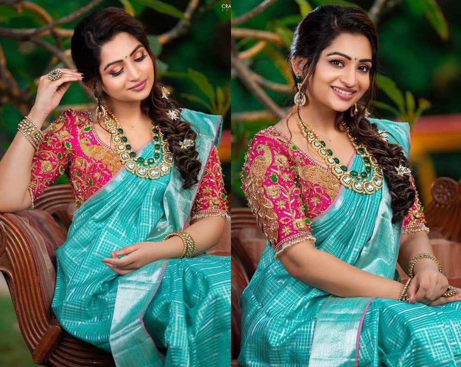 nakshatra nagesh in a blue silk saree with pink blouse