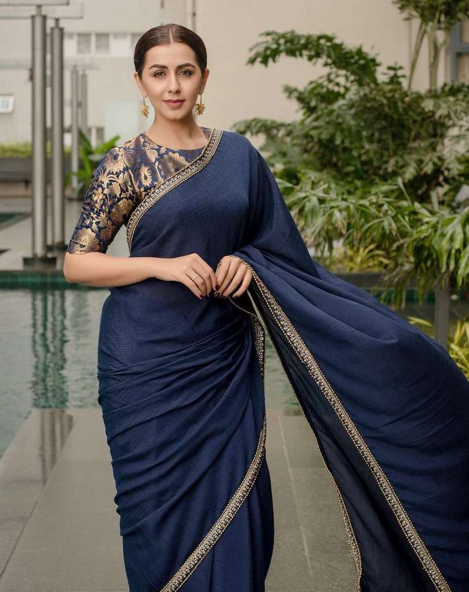 nikki galrani in a navy blue georgette saree with brocade blouse