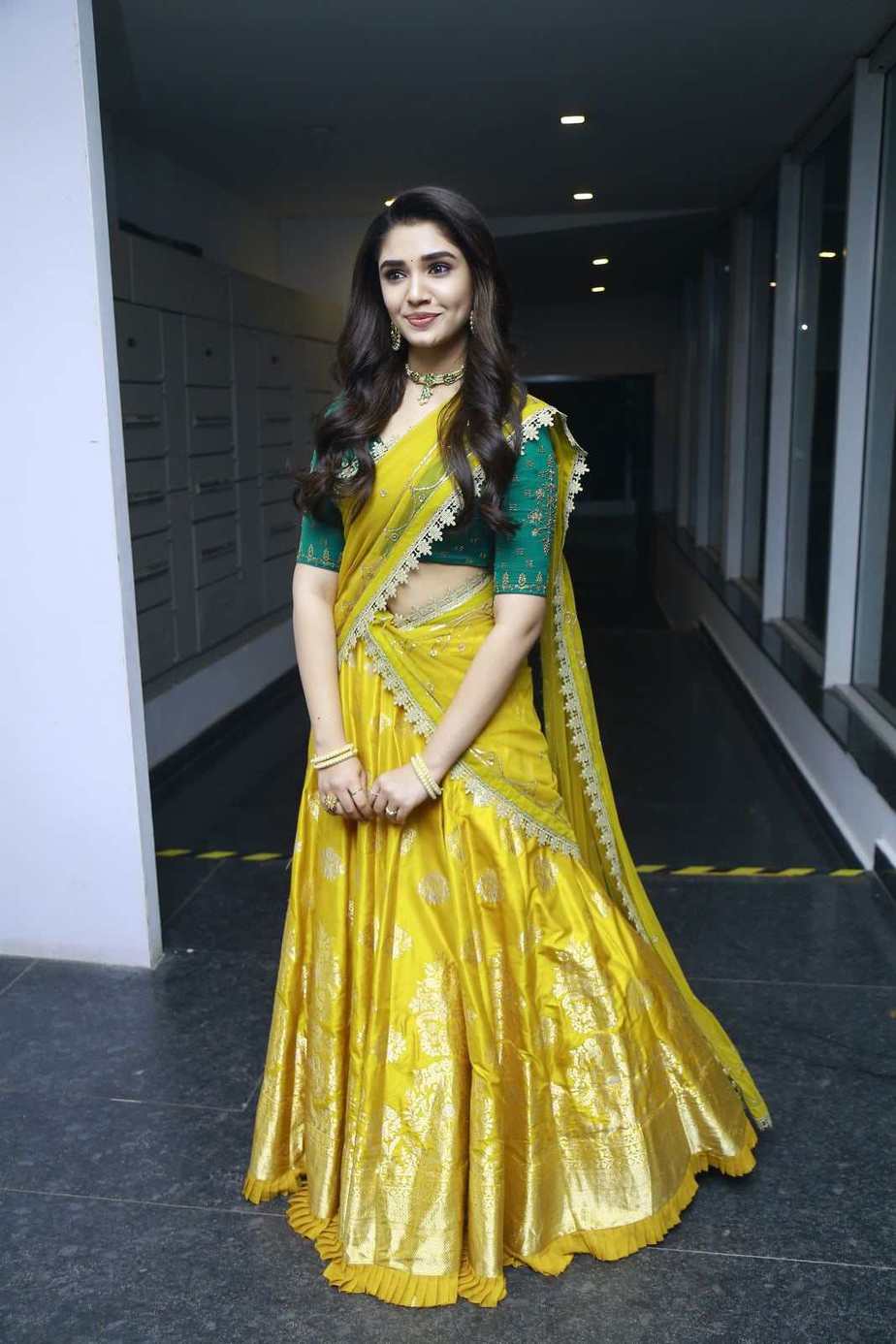 Krithi Shetty stuns in a yellow half-saree at