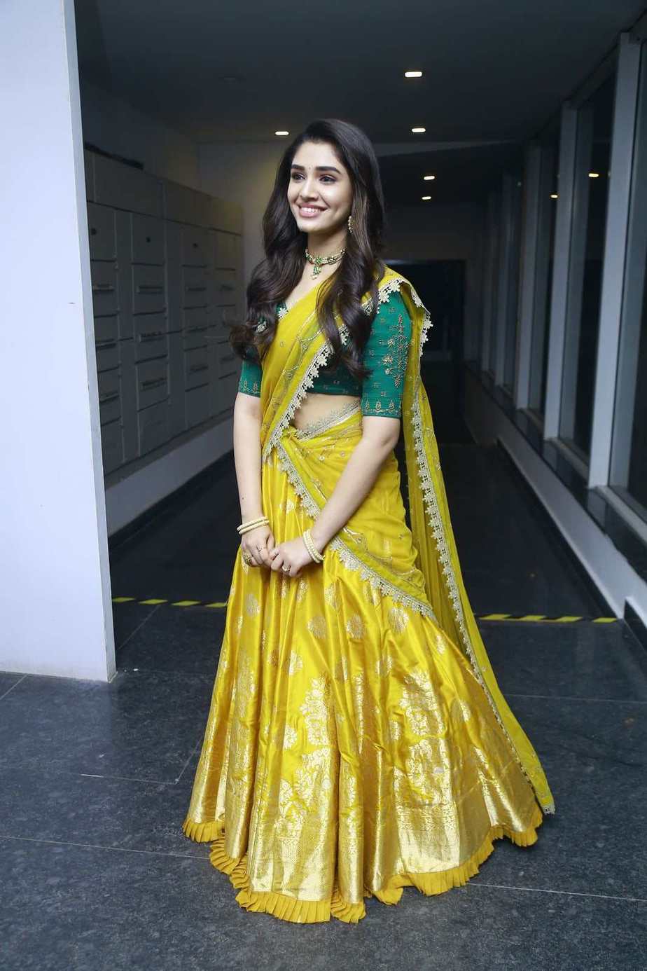 Krithi Shetty stuns in a yellow half-saree at