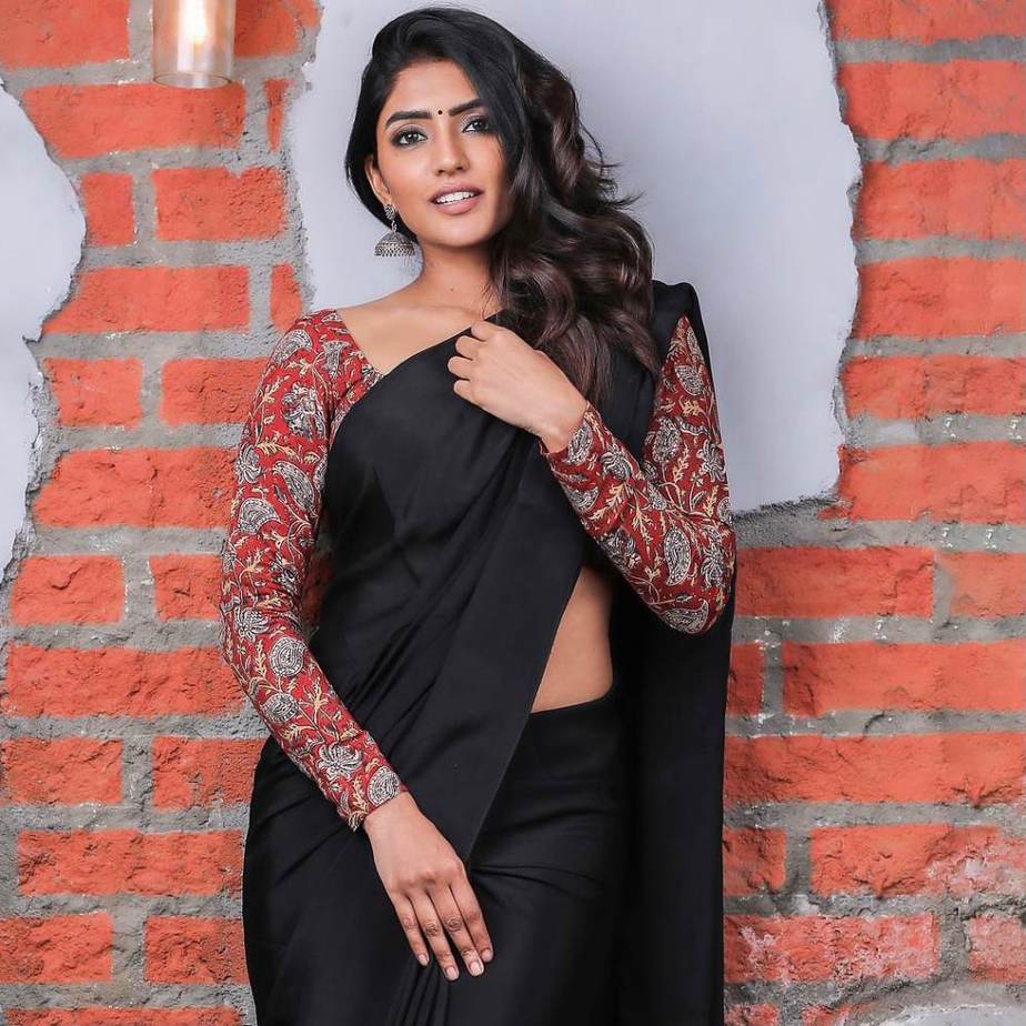 eesha rebba in black saree and red kalamkari blouse