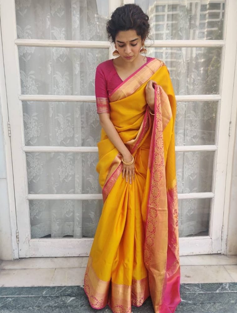 mithila palkar in yellow silk saree with pink gold border