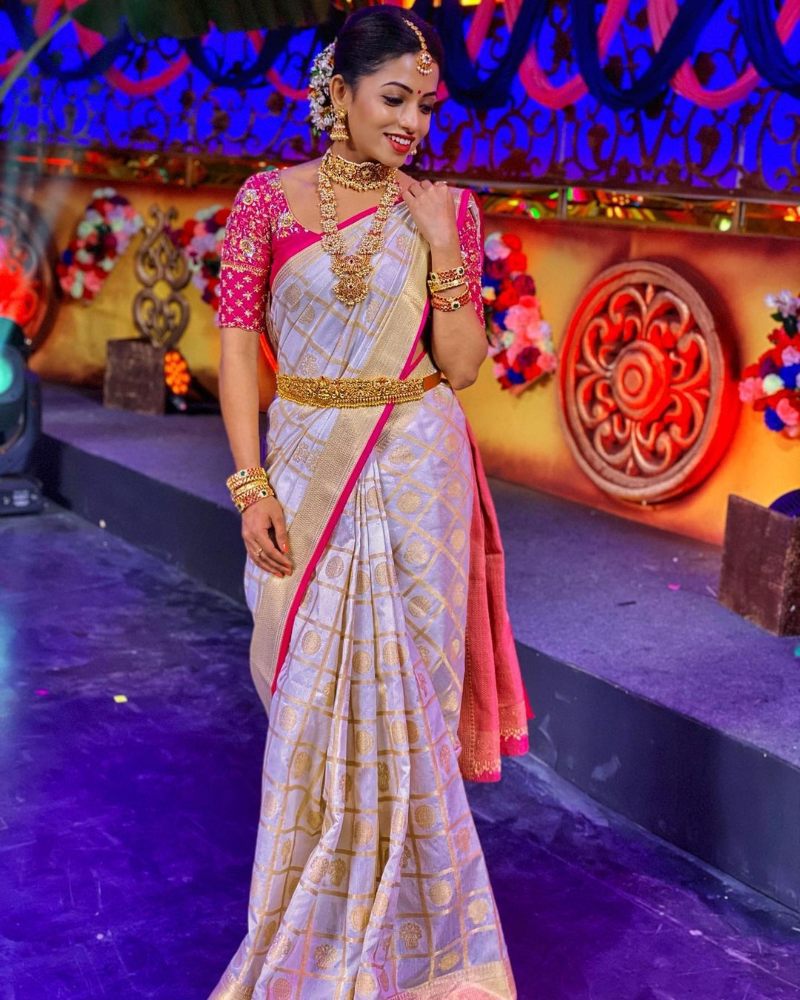 navya swamy in gold and pink silk saree