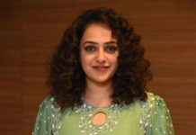 nithya menen in a long green kurta