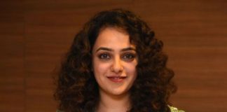 nithya menen in a long green kurta