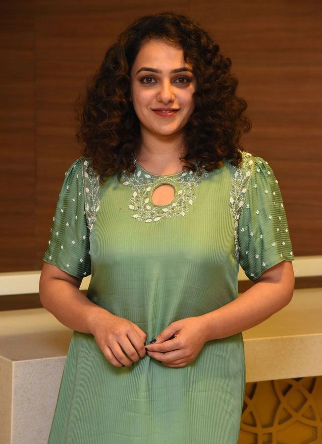 nithya menen in a long green kurta