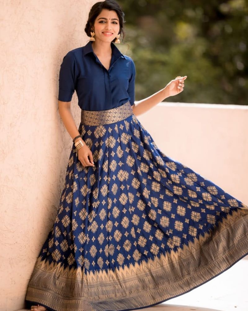 sai dhansika in a long blue skirt and shirt