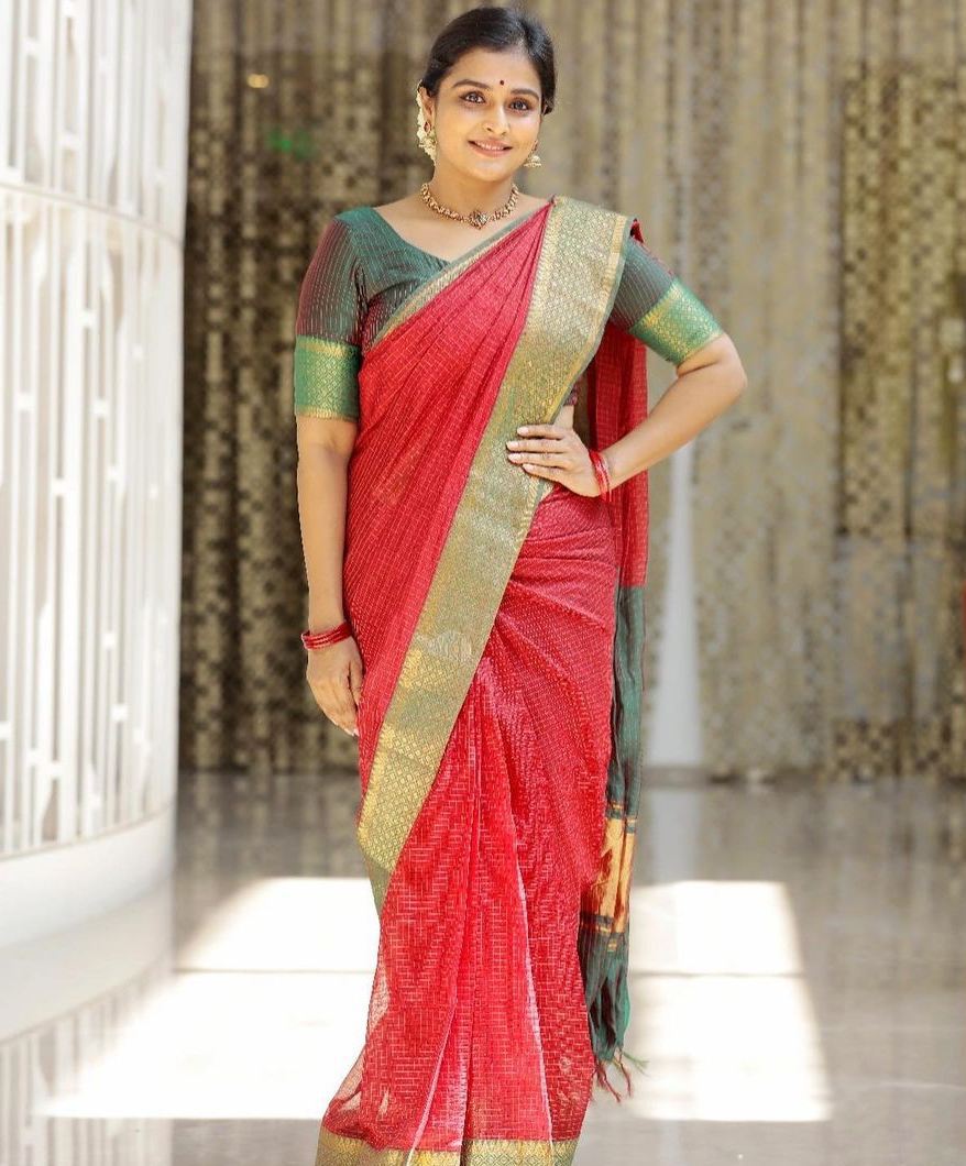 Ramya Nambessan in a red traditional saree!