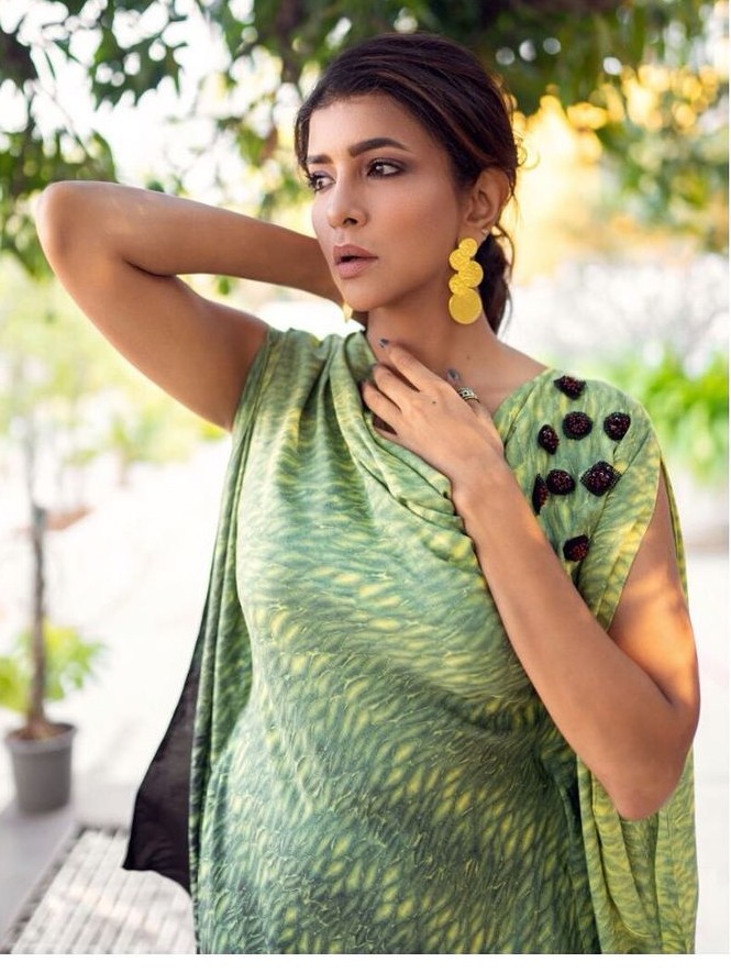 lakshmi manchu in a green yellow cowl top