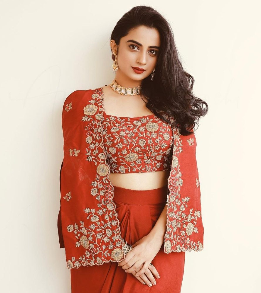 namitha pramod in a red embroidered jacket and skirt set