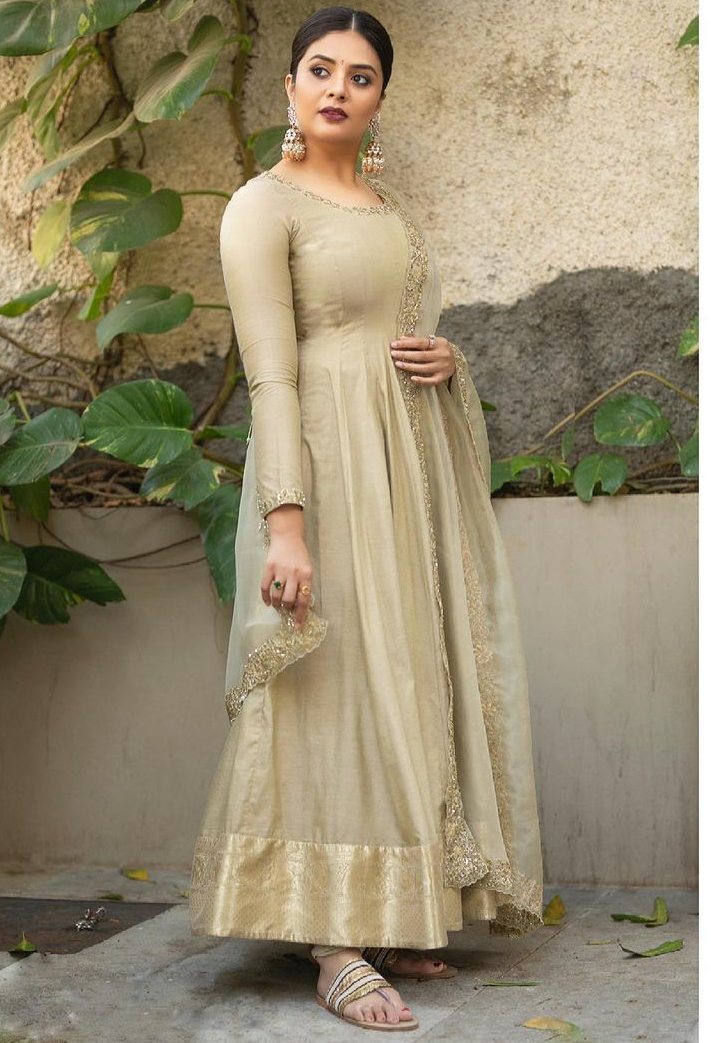 sreemukhi in a beige anarkali with gold sequin work