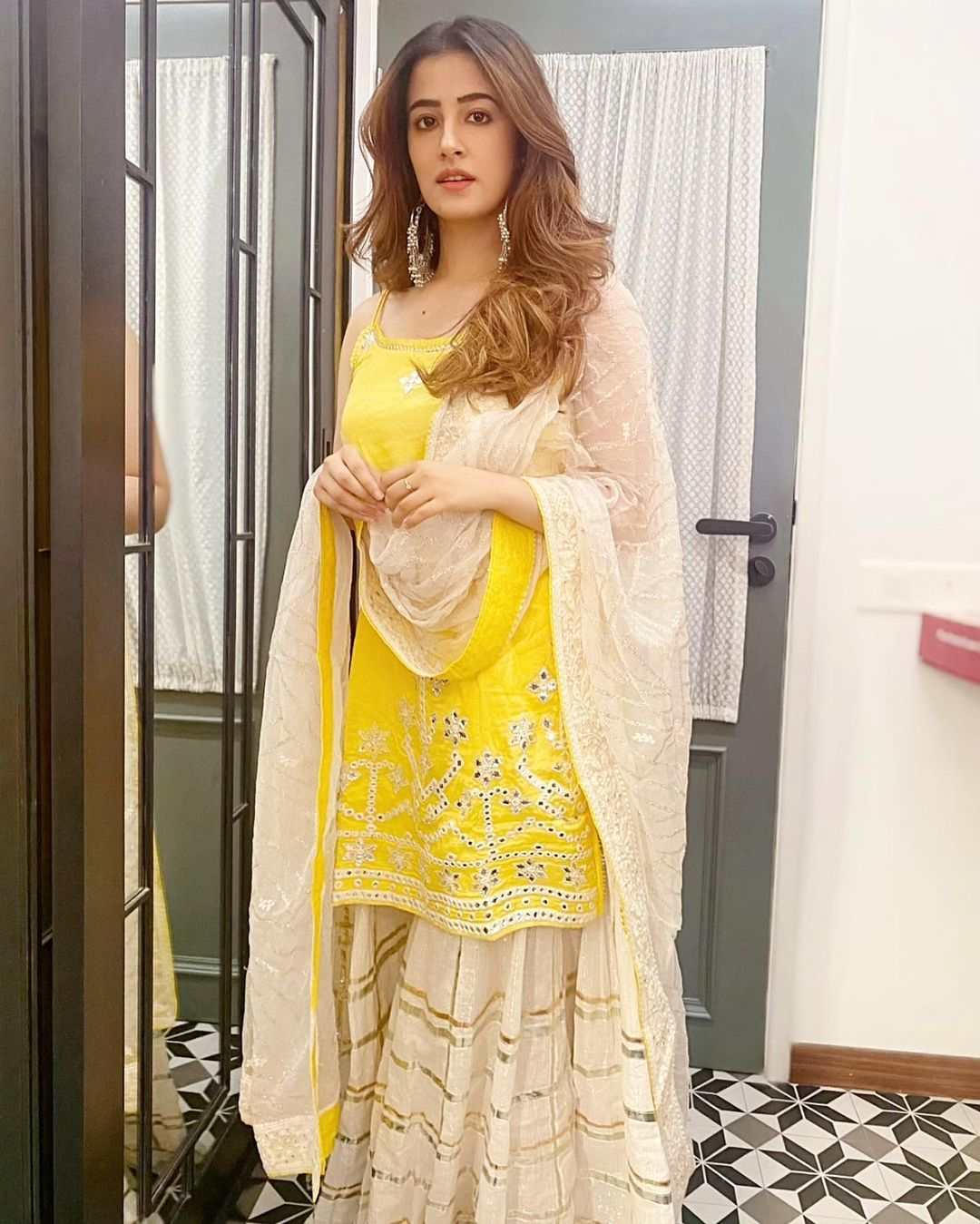 Nupur Sanon shines bright in a yellow-white sharara set!