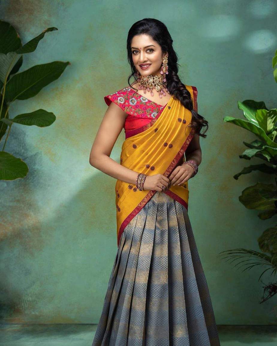 Vimala Raman poses in a multi-coloured half-saree for a clothing ...