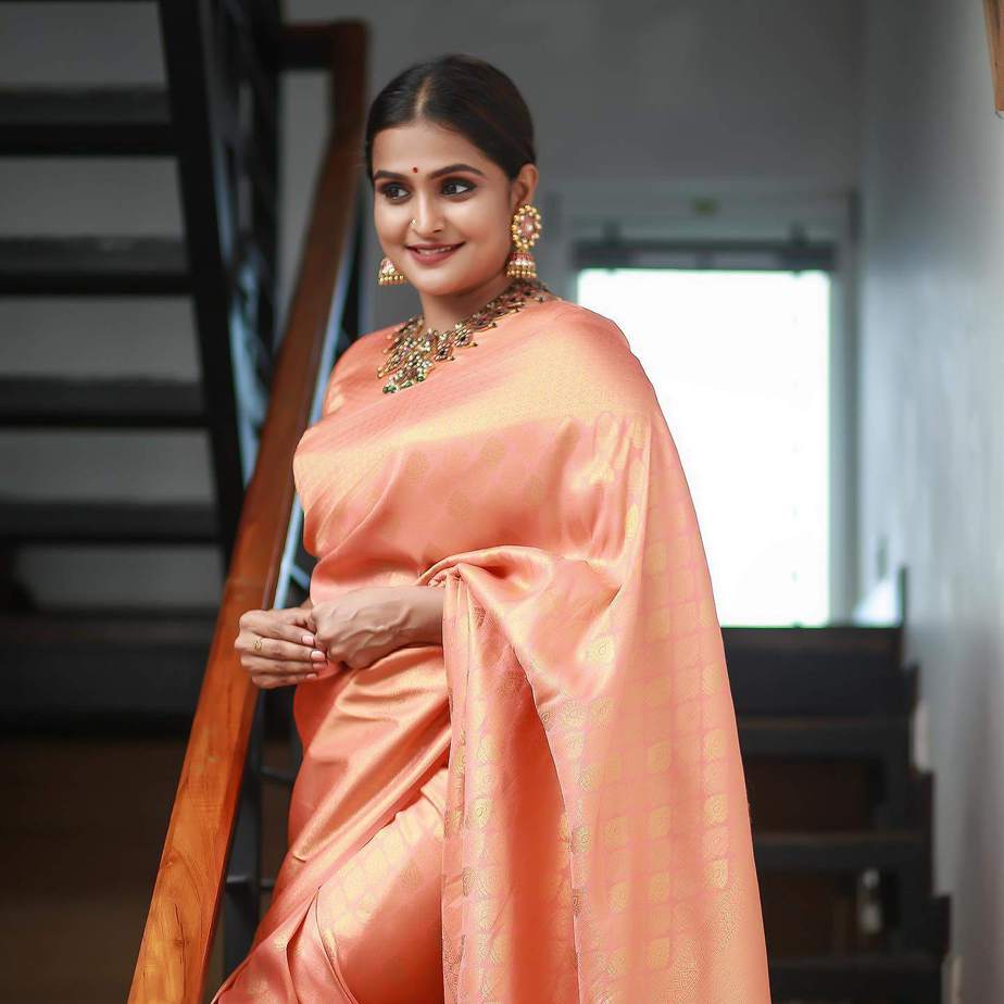 Ramya Nambeesan looks stunning in a peach pattu saree