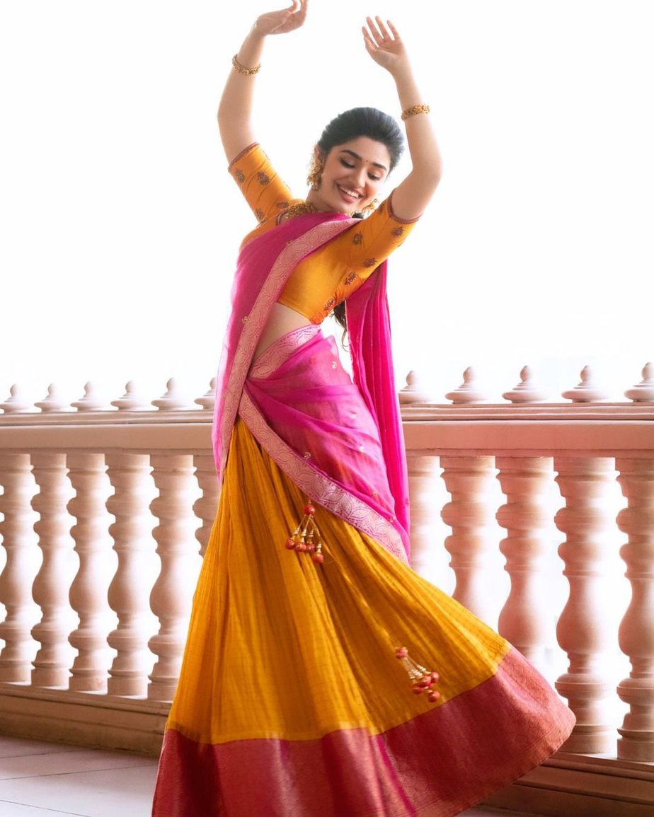 Krithi Shetty in a pink & yellow traditional half-saree by ...