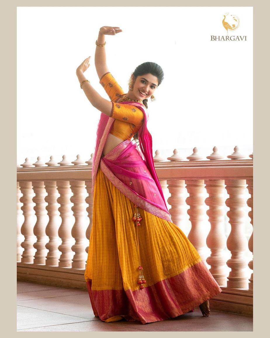 Krithi Shetty in a pink & yellow traditional half-saree by ...