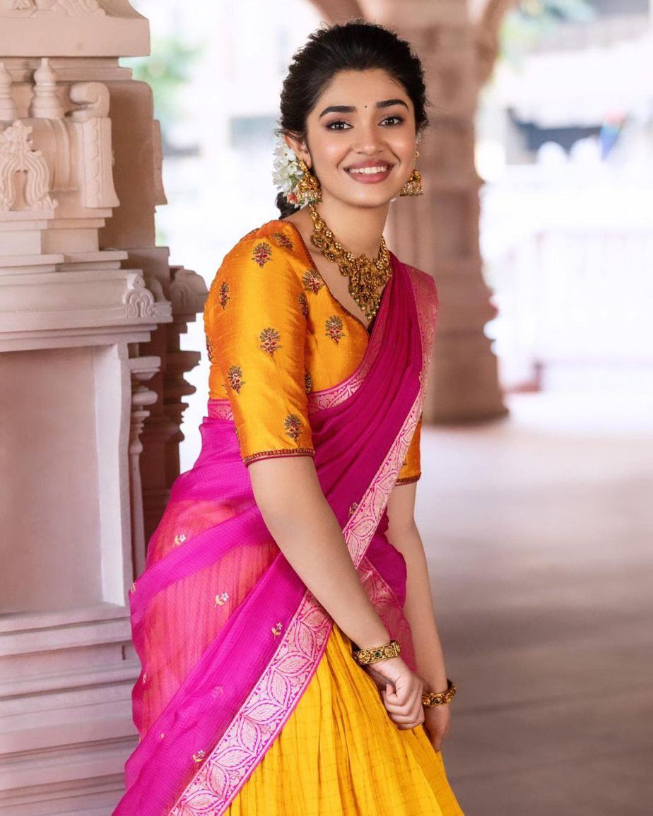 Krithi Shetty in a pink & yellow traditional half-saree by ...