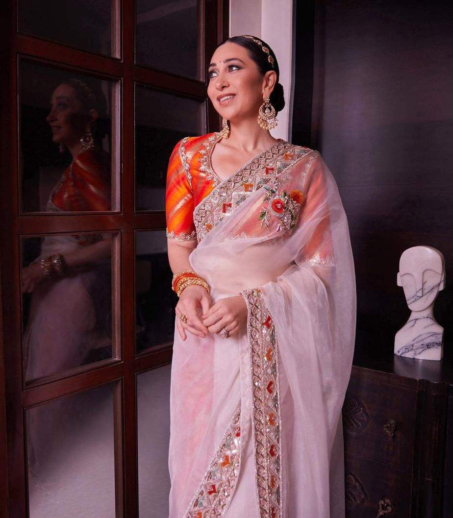 Karisma Kapoor looks splendid in an ivory sheer saree at Ranbir Kapoor's wedding!