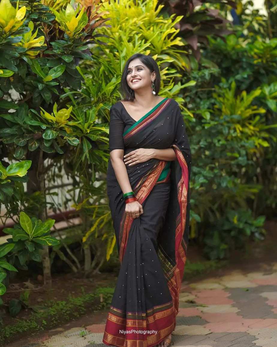 Ramya Nambessan's traditional look in a black mirror work saree!