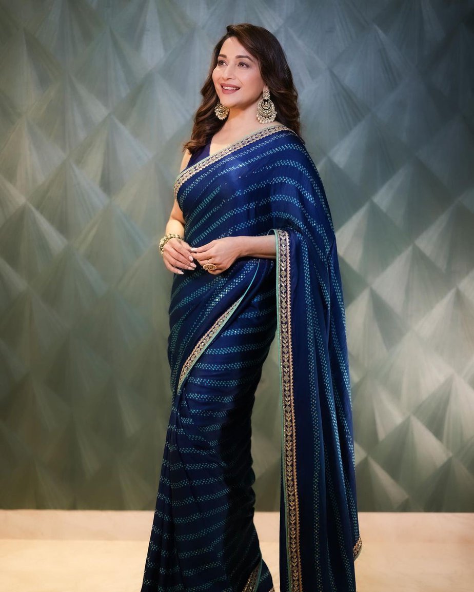 Madhuri Dixit looks effortlessly graceful in a blue saree!