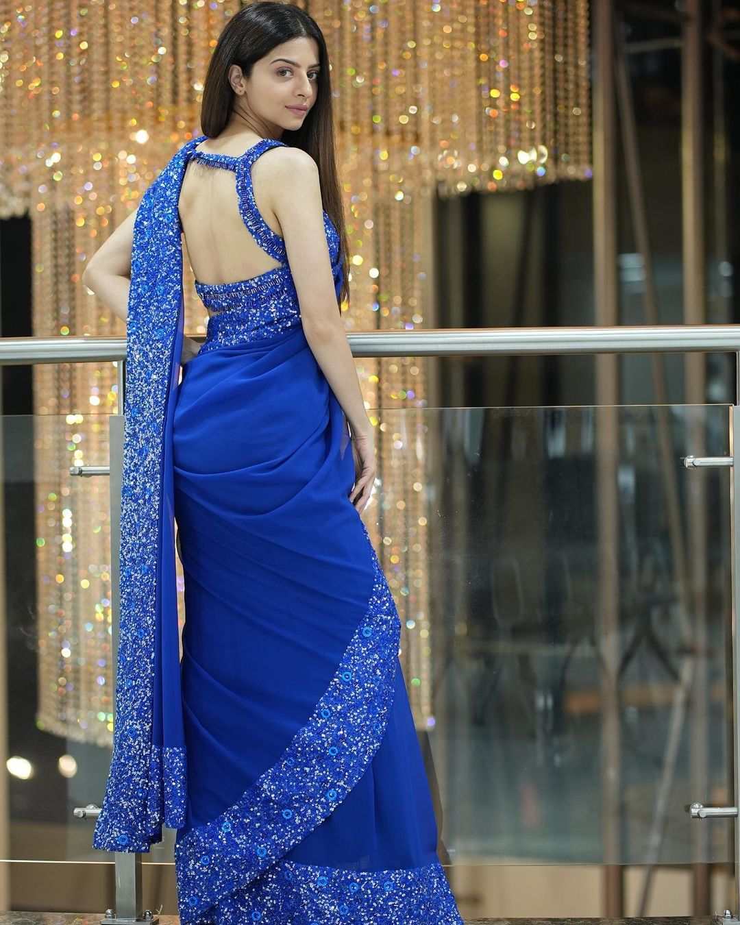 Vedhika dazzles in a blue sequinned saree for a movie launch!