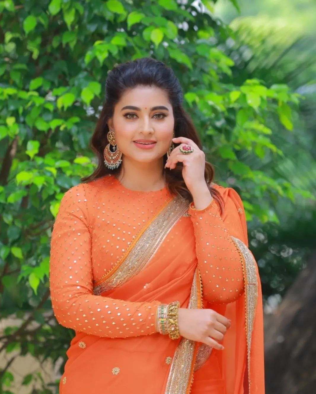 Sneha Prasanna looks beautiful in an orange saree!